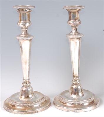 Lot 1153 - A pair of George III silver table candlesticks,...