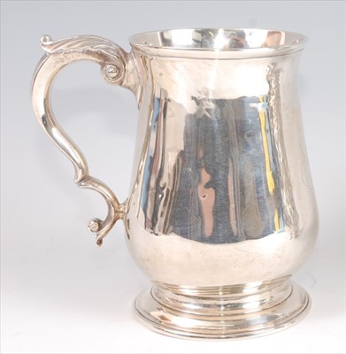 Lot 1157 - A George II silver bell shaped tankard, having...