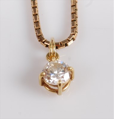 Lot 1225 - A yellow metal diamond single stone pendant,...