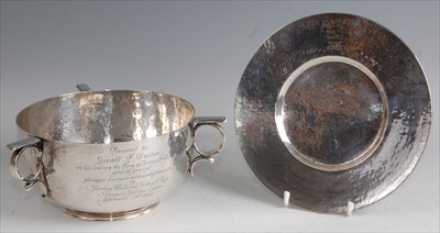 Lot 142 - An Arts & Crafts silver circular three handled...