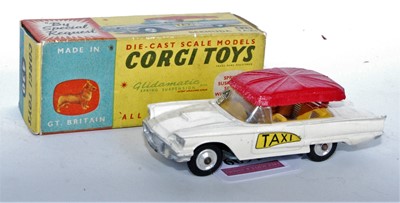 Lot 1609 - A Corgi Toys No. 430 Bermuda Taxi comprising...