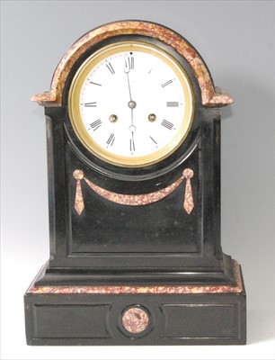 Lot 1451 - A Victorian polished slate mantel clock, the...