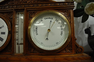 Lot 21 - A Victorian carved oak desk weather station,...