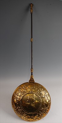 Lot 1314 - A 17th century Dutch brass warming pan, the...