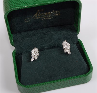 Lot 1236 - A pair of 18ct white gold diamond cluster...