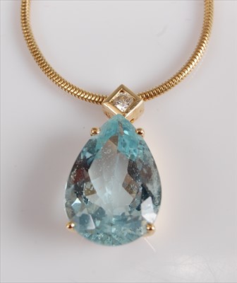 Lot 1226 - A yellow metal pear cut aquamarine pendant, in...