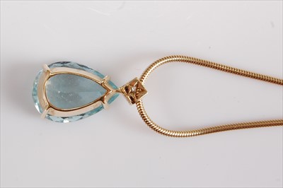 Lot 1226 - A yellow metal pear cut aquamarine pendant, in...