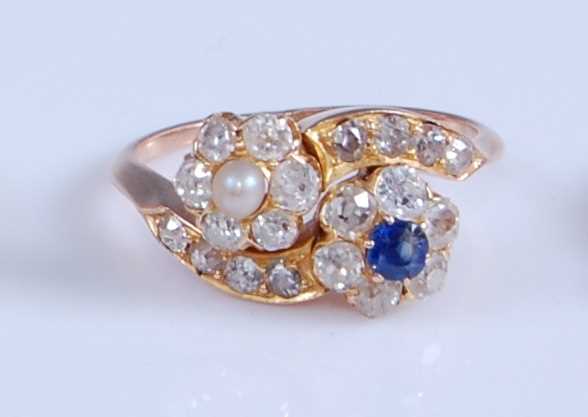Lot 1211 - A rose and yellow metal, diamond, sapphire and...