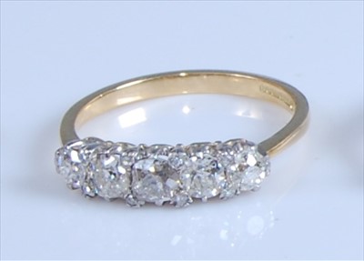 Lot 1244 - An 18ct yellow and white gold diamond...