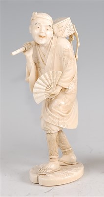 Lot 1342 - A Japanese Meiji period carved ivory okimono,...