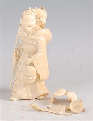 Lot 1343 - A Japanese Meiji period carved ivory okimono,...