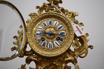 Lot 3 - A Rococo Revival gilt brass mantel clock, the...