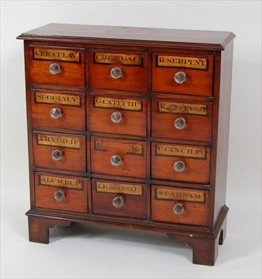 Lot 1540 - An antique mahogany and fruitwood pharmacy...