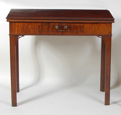 Lot 1525 - A George III mahogany tea table, the fold-over...