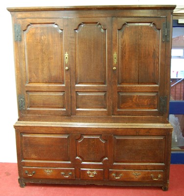 Lot 1493 - A George III joined oak housekeepers cupboard,...