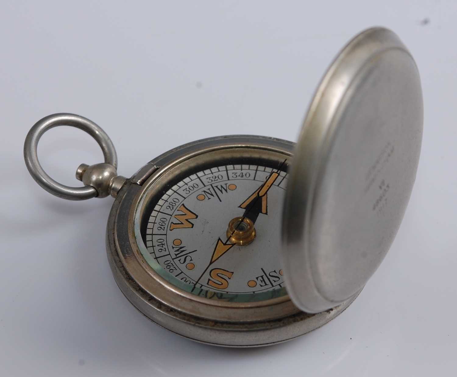Lot 57 - A WW I Dennison Mk VI nickel cased pocket compass