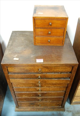 Lot 322 - An oak eight drawer collector's chest...