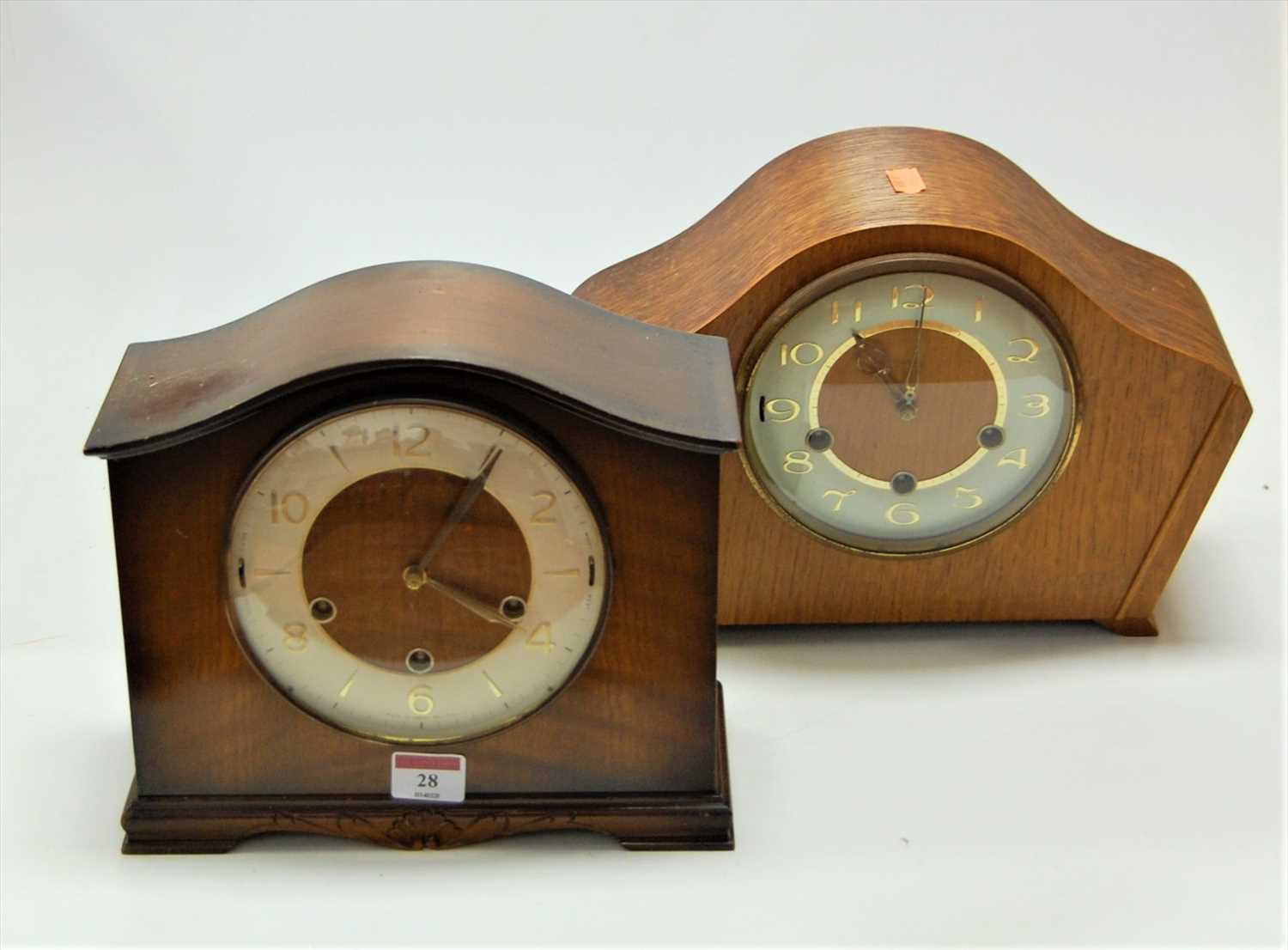 Lot 28 - A 1950s oak cased mantel clock having a...