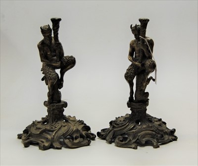 Lot 33 - A pair of brass figural candlesticks, each in...