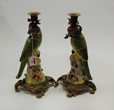Lot 40 - A pair of reproduction figural table candle...
