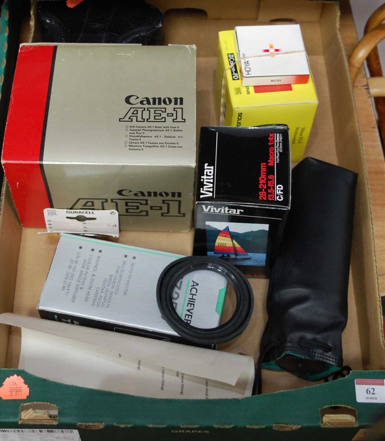 Lot 62 - A Canon AE1 SLR camera and accessories