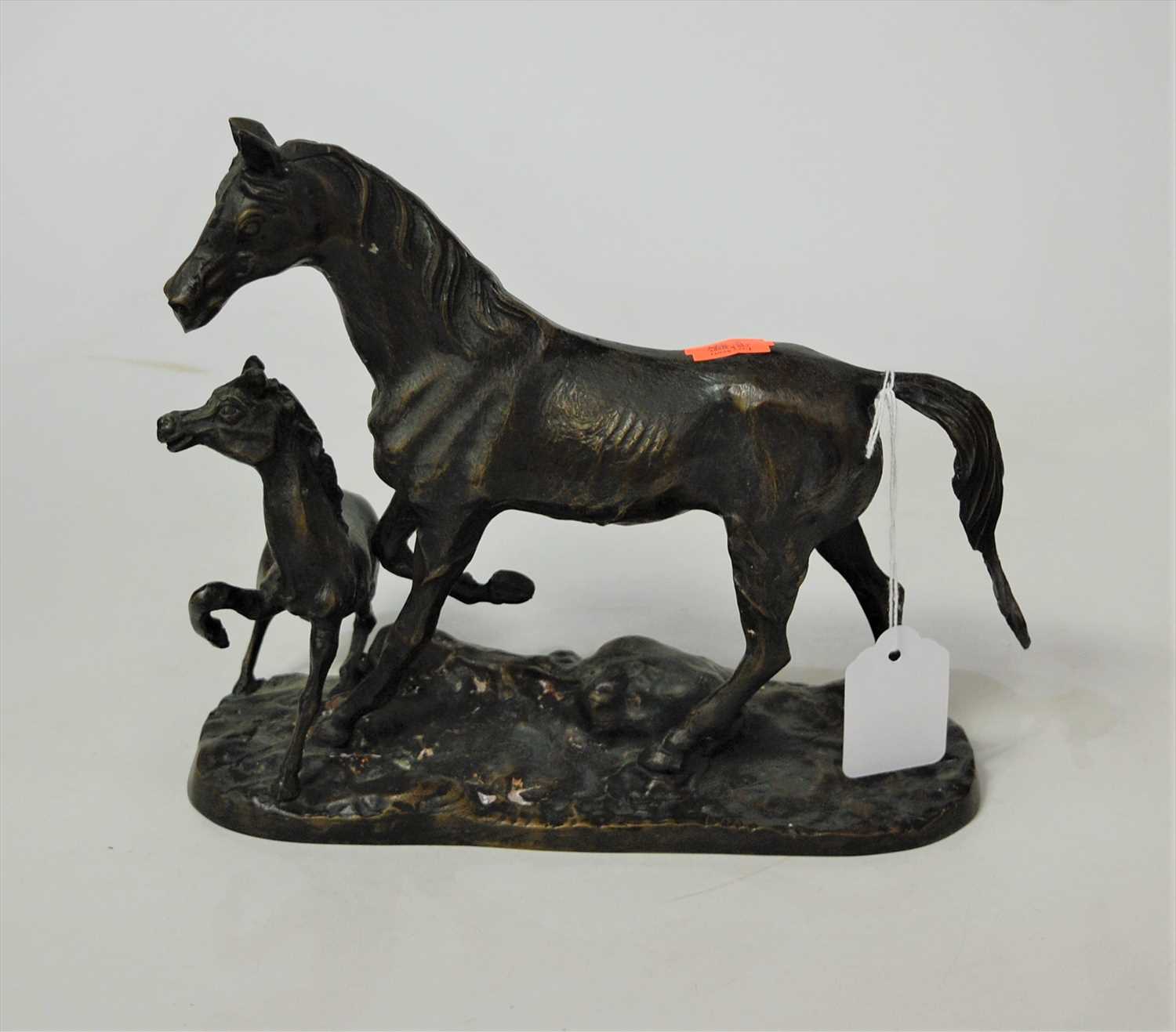 Lot 80 - A spelter model of a horse and foal on...