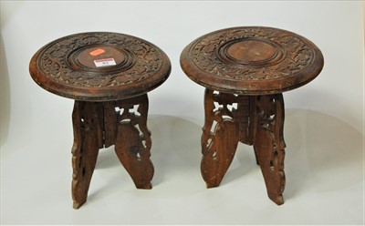 Lot 82 - A pair of Indonesian heavily carved plant stands