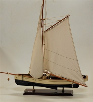 Lot 106 - A painted wooden model of a yacht with full...