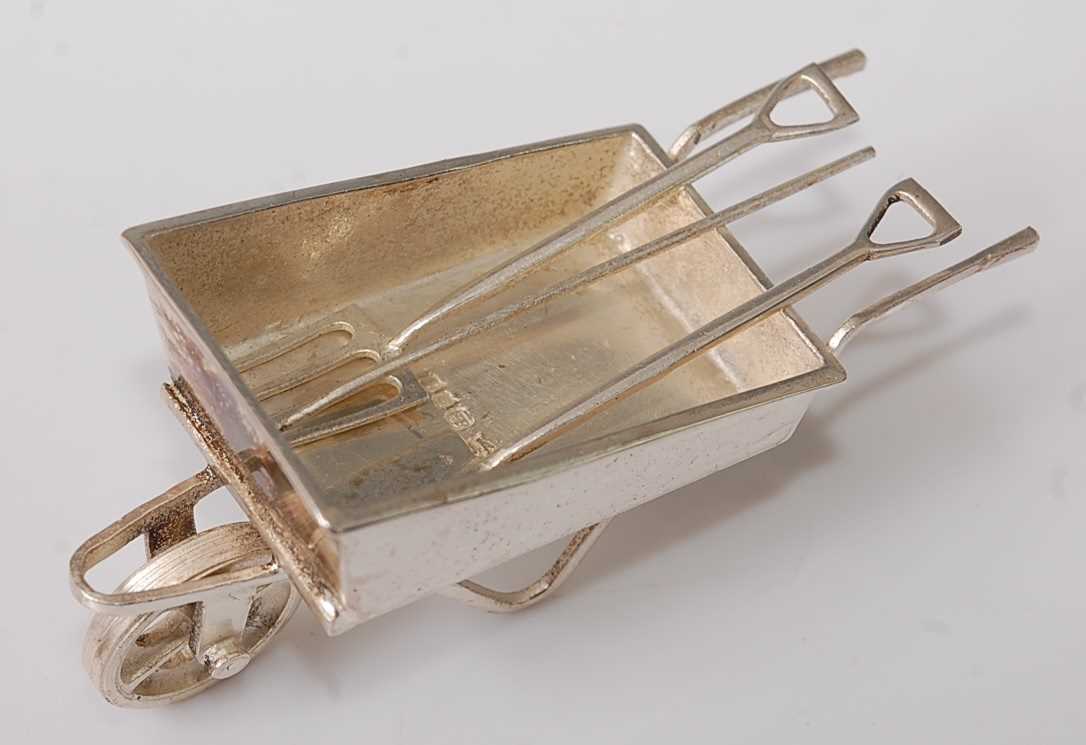 Lot 365 - A modern silver miniature wheelbarrow;...