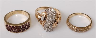 Lot 386 - A 9ct gold garnet set dress ring; together...