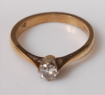 Lot 406 - A 9ct gold diamond solitaire ring, the claw...