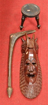 Lot 127 - A carved softwood tribal style wall mask...