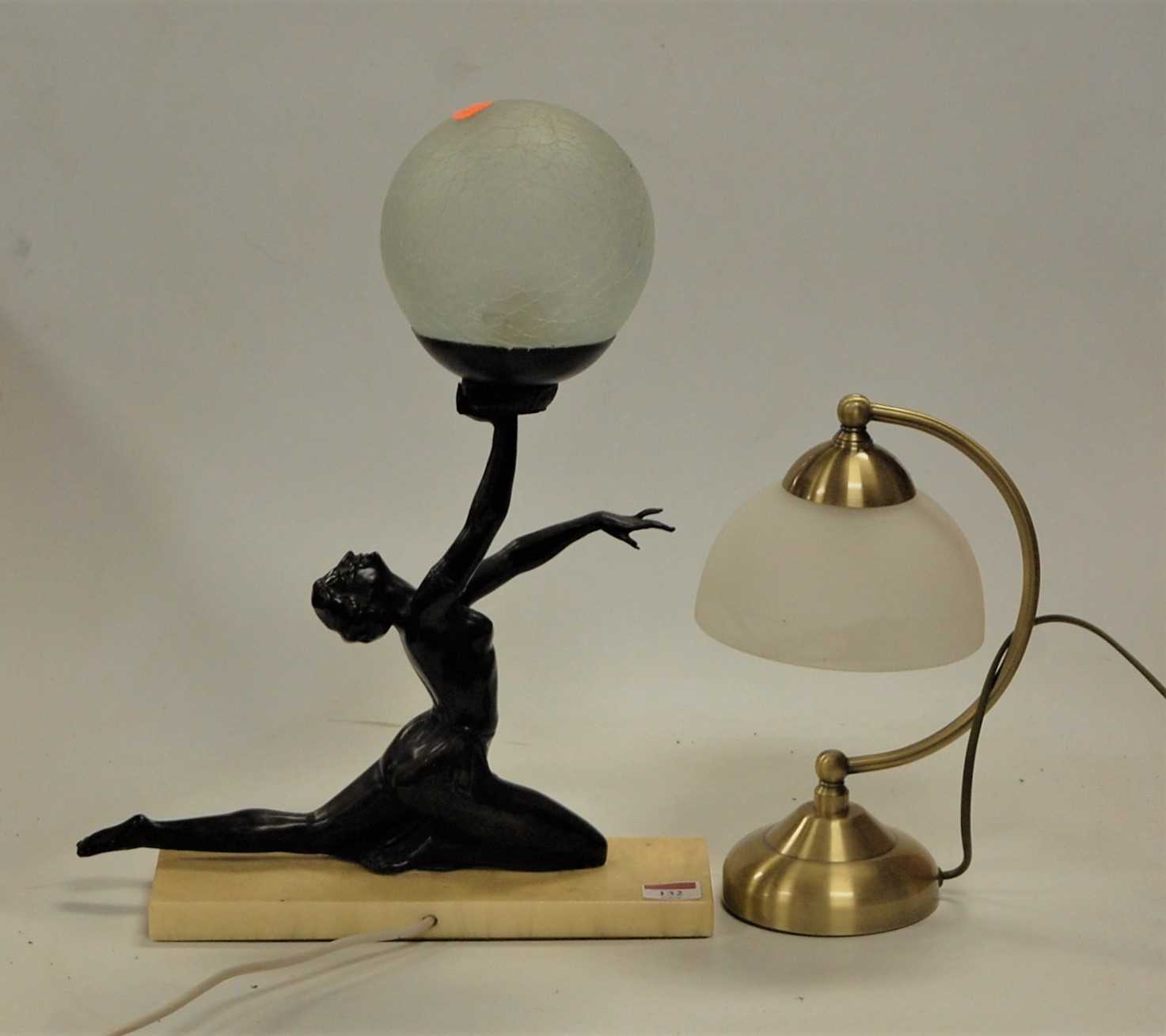 Lot 132 - An Art Deco style table lamp the spelter...