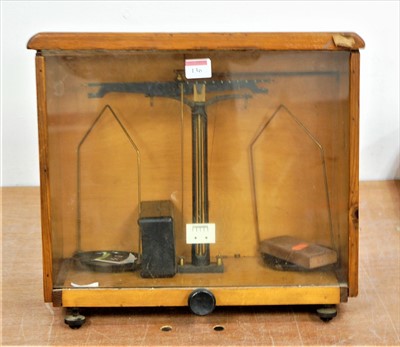 Lot 136 - A mid 20th century pine cased set of chemist's...