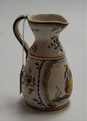 Lot 180 - An 18th century Delft jug, the central reserve...