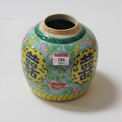 Lot 186 - A Chinese stoneware ginger jar, on a yellow...