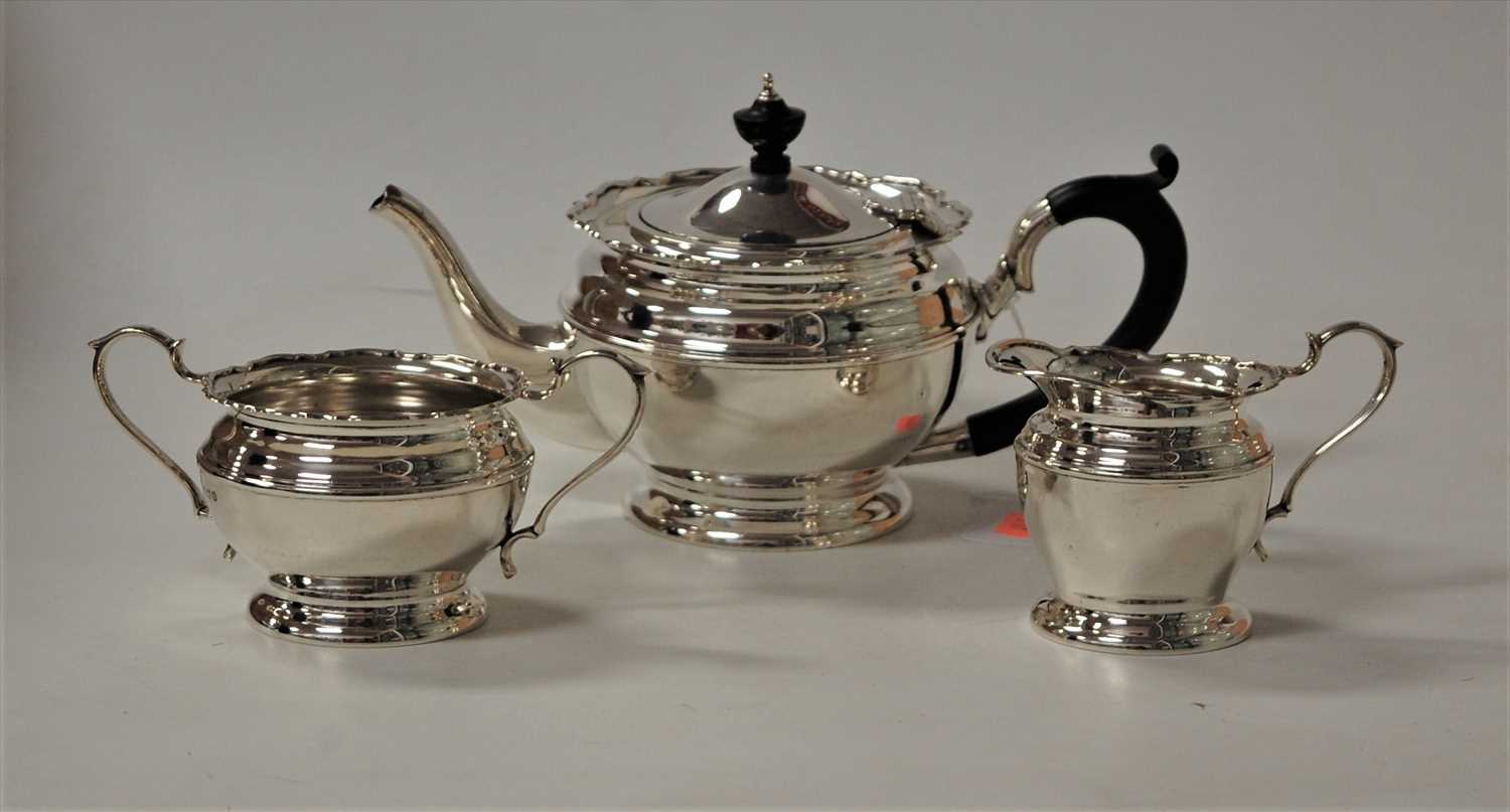 Lot 224 - A George V bachelors silver three-piece tea...
