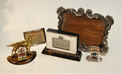 Lot 297 - A George V silver clad perpetual desk calendar,...