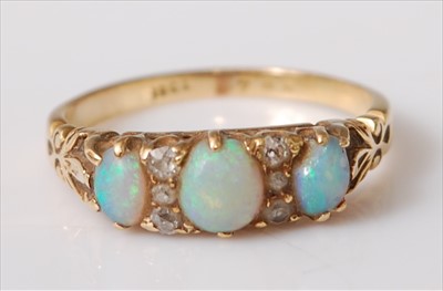 Lot 2208 - A yellow metal carved head opal and diamond...