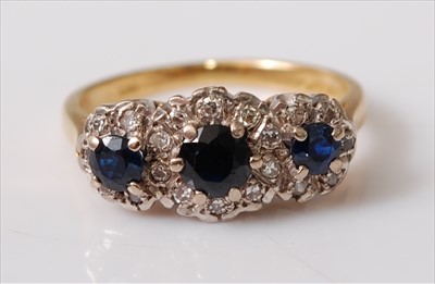 Lot 2213 - An 18ct yellow and white gold, sapphire and...