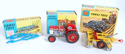 Lot 1670 - A Corgi Toys boxed tractor and farm implement...