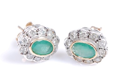 Lot 2215 - A pair of 9ct yellow and white gold, emerald...