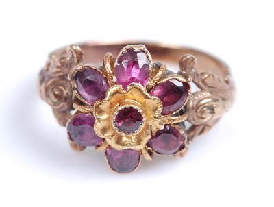 Lot 2220 - A late 19th century garnet ring, comprising a...