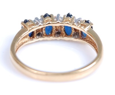 Lot 2005 - An 18ct yellow and white gold, sapphire and...