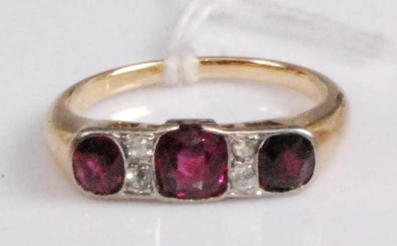 Lot 2046 - A yellow metal, ruby and diamond ring,...