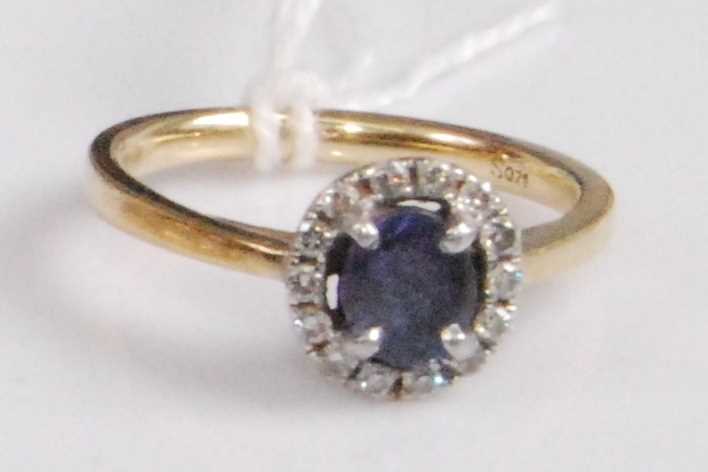 Lot 2048 - An 18ct gold, sapphire and diamond cluster...