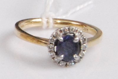 Lot 357 - An 18ct gold, sapphire and diamond cluster...