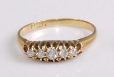 Lot 2095 - An 18ct gold diamond five-stone ring, the...