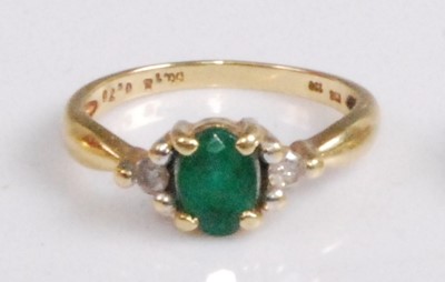 Lot 314 - An 18ct gold, emerald and diamond dress ring,...