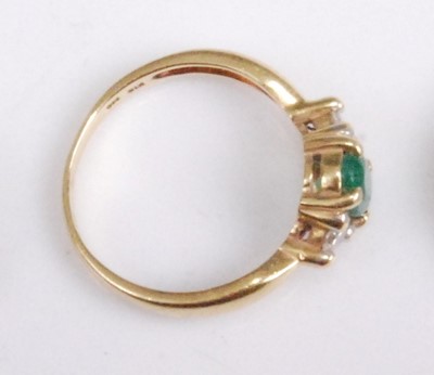 Lot 2096 - An 18ct gold, emerald and diamond dress ring,...